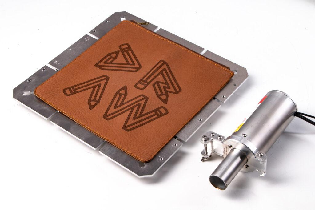 Leather case mounted on ZMorph VX CNC worktable and Laser PRO toolhead